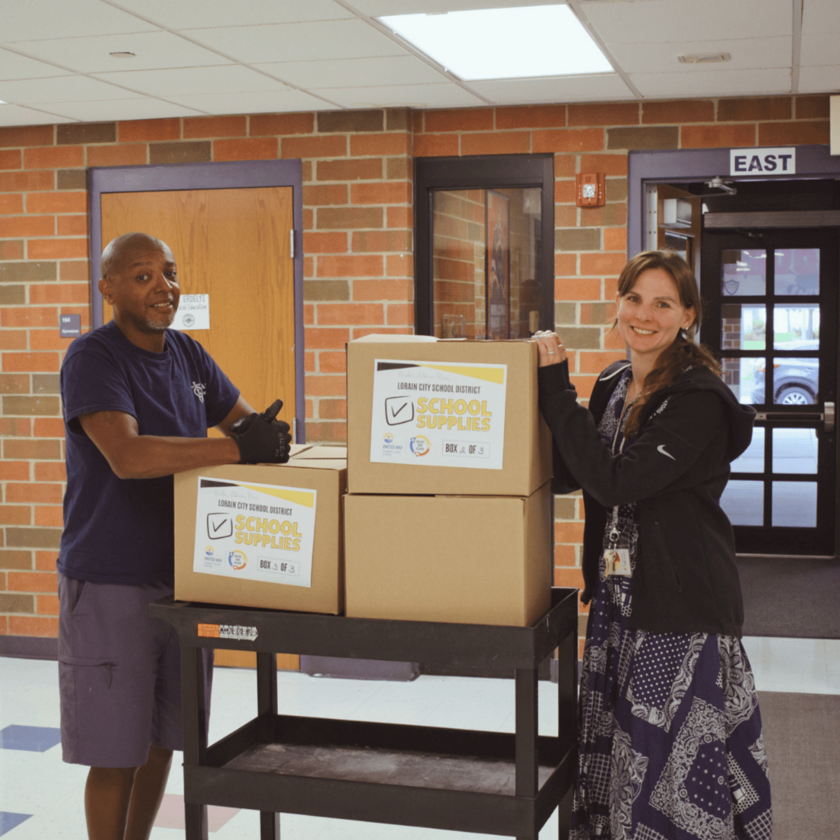 School staff members get school supply delivery.