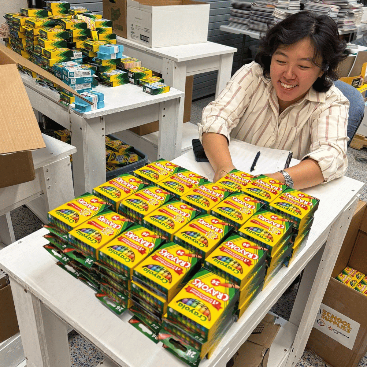 United Way staff member sorting crayons
